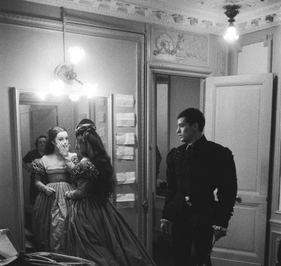 romyandalain:Alain Delon and Romy Schneider kissing in their dressing room, 1961. at the Théâtre de Paris. They were performing the play Tis Pity She’s a Whore  dir. by Luchino Visconti
