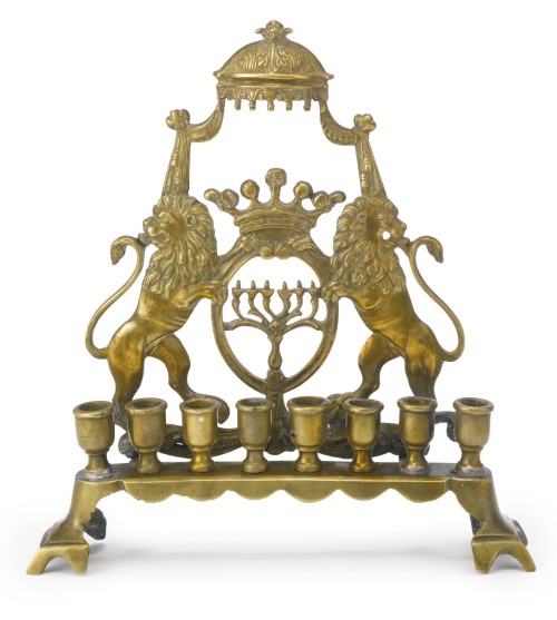 ir-hakodesh:1. Brass Hanukah lampthe openwork backplate modeled as a pair of lions holding an oval f