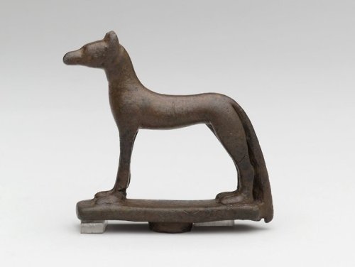 Ancient Egyptian bronze amulet in the form of a wolf/jackal, representing the deity Wepwawet, who wa