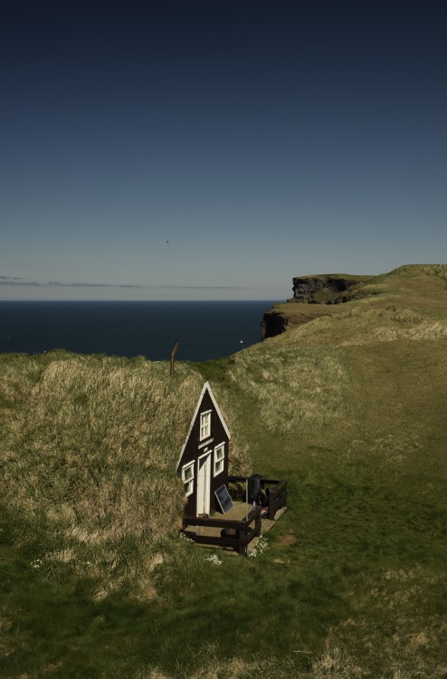 cabinporn:Icelandic earth house at Drangey Cliff. One of the most stunning bird cliffs in Iceland.&n