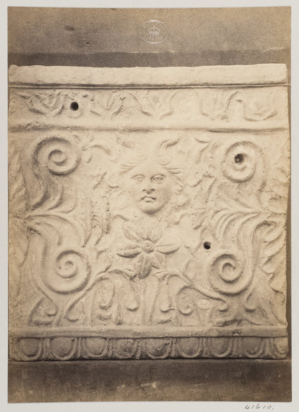 Photograph by Louise Laffon, Bas-relief portion of a frieze with a mask in terra cotta, part of a se