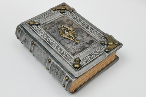  Aged white leather journal with the Skyrim map in the center of the front cover. Over the map is mo