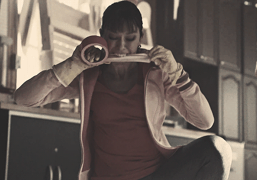 Sexuality: Alison Hendrix ripping pink duct tape with her teeth.