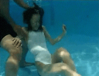 Women Blowing Bubbles Underwater