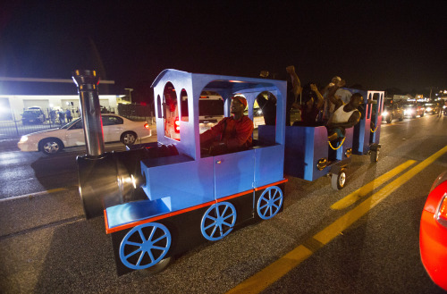 yahoonewsphotos: The peaceful side of the Ferguson protests Nightly chaos in the St. Louis suburb is