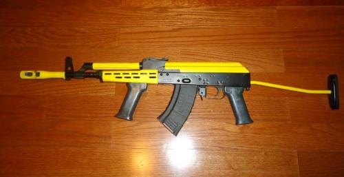 gunrunnerhell:  AMD-65 Not sure what possessed the owner to paint parts of his rifle banana yellow but to each their own. The AMD-65 is a Hungarian AK variant notable for it’s distinct appearance. They actually have a much shorter overall length in