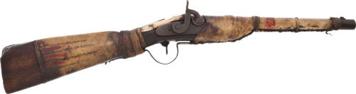 A mid 19th century percussion musket adapted by Native Americans (cut down and leather wrapped.