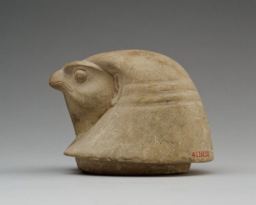 Canopic jar lid (limestone) in the shape of a falcon head, representing the deity Qebehsenuef, one o