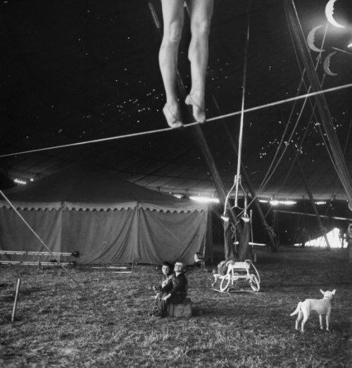 last-picture-show:Nina Leen, Two small children watching a circus performer practicing on a tightrop