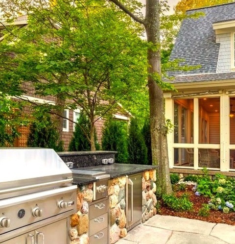 Picture Of A Medium-sized, Elegant Backyard Stone Patio Kitchen Without A Cover