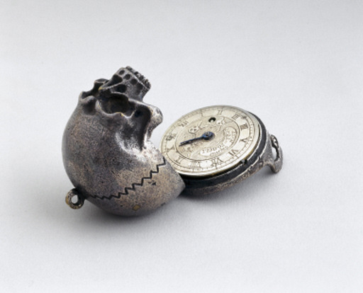 sixpenceee:  Pocket watch concealed in a memento mori, 1700-1936. The engraved Latin