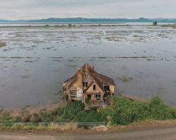 archatlas:Ghostly Aerial Photos Frame Isolated and Abandoned Houses Scattered Across North AmericaIn his ongoing series titled Thin Places, Portland-based photographer Brendon Burton documents battered houses that stand alone in barren fields, amidst