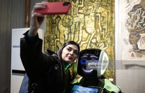 Visitors communicate with Mamed, a robot guide at the Naryn-Kala citadel, Derbent, Dagestan (2019).M