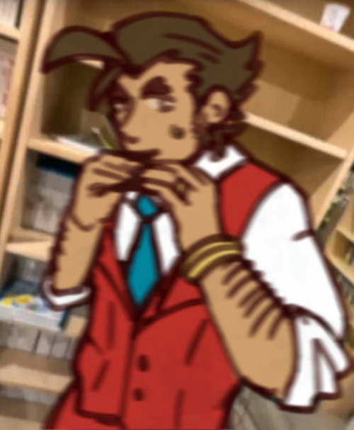 A drawing of Apollo Justice, superimposed on an image of Youtuber Scott the Woz. He is eating a chocolate bar with both hands. The image has been motion blurred, suggesting it was taken by someone catching him in the act.