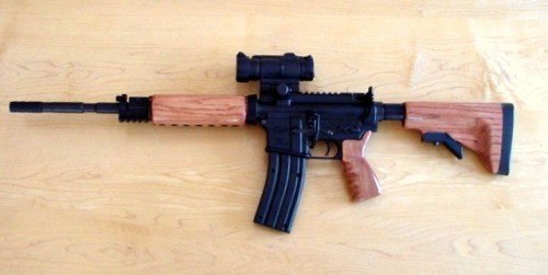 gunrunnerhell:  CustomA CMMG Quebec-A with wooden furniture. The Quebec-A is a dedicated .22 LR AR-15, although I’m not exactly sure why it has that name. I’ve seen wooden stocks for the AR-15 but mostly as a fixed A2 style. It’s interesting to