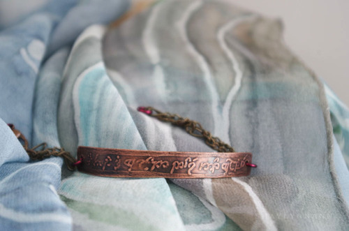 I’m doing a giveaway of this Elvish bracelet over at my (non-Tumblr) blog!The front of the bracelet 