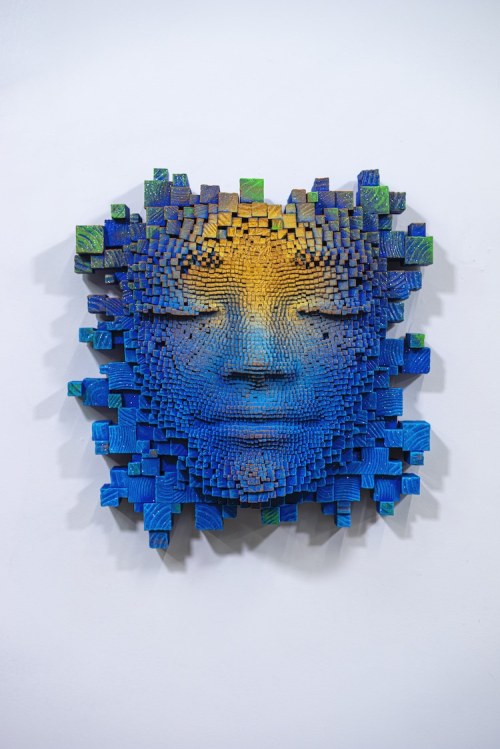 Face to FaceSculptor Gil Bruvel creates pixelated portraits from thousands of wood sticks. The anony