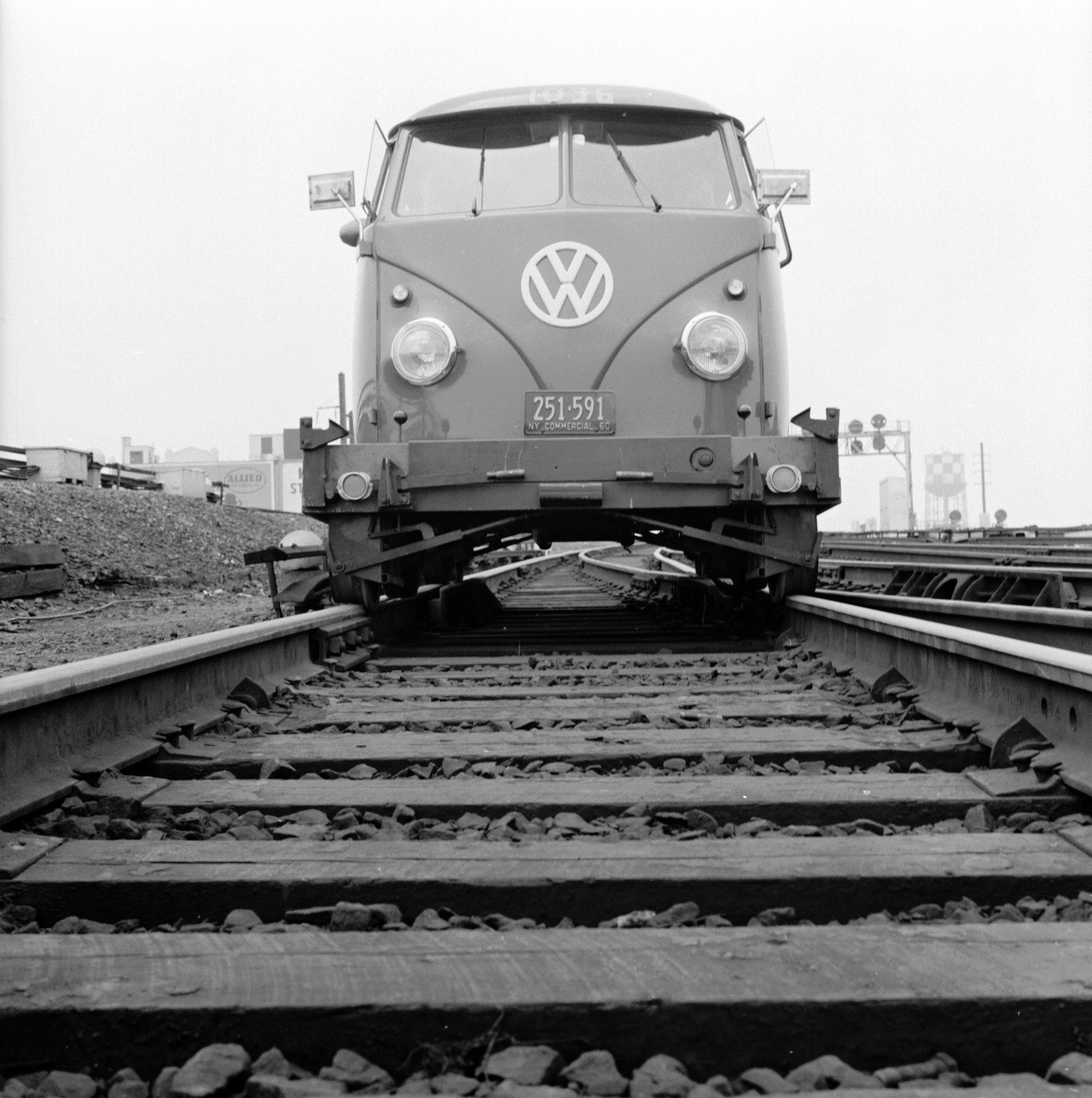 The new Volkswagen travelling along the tracks of the Long Island railroad. This