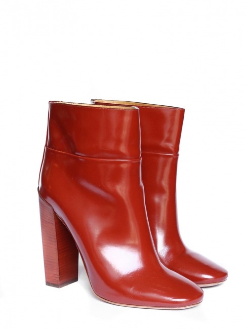 Caroline Sieber wearing Chloé Stacey high heel ankle boots in red polished leather.