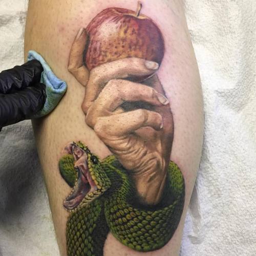 Photorealistic hand, apple, and snake piece that Half Pint has been chipping away on lately.