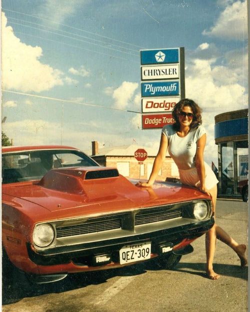 jrs1717:Back in the day at the dealership. A 1970 Plymouth Barracuda girl