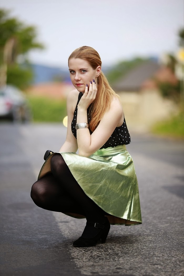 pantyhoseparty:  Lucie Srbová in black tights, shiny faded green skirt and black