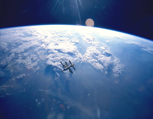 Russian space station Mir, backdropped against Earth, taken from the Space Shuttle Atlantis at the e