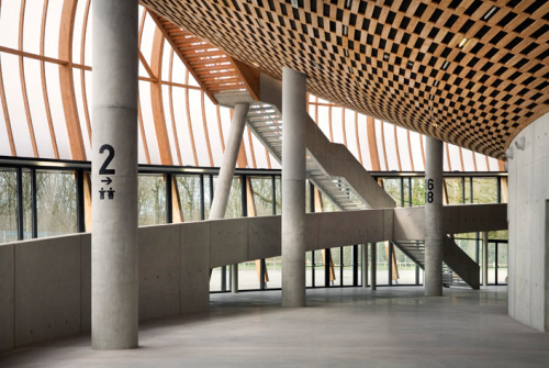 archatlas:  Limoges Concert Hall Bernard Tschumi Architects “The concept for the project began with a double envelope: an outer skin made of wood arcs and translucent rigid polycarbonate sheets and an inner acoustical envelope of locally grown