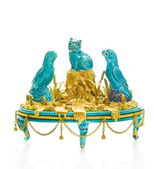 A French gilt-bronze mounted turquoise-glazed Chinese porcelain group with two parrots and a cat on 