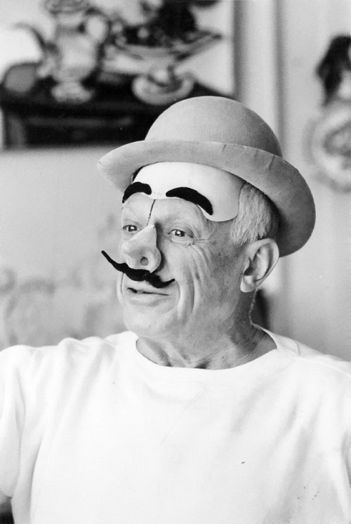 Picasso in the mask of a clown. Villa California, Cannes, 1957