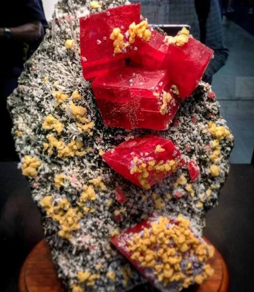 geologyin-blog: Deep color #rhodochrosite from Colorado at the Tucson gem show Photo: Matrix India M