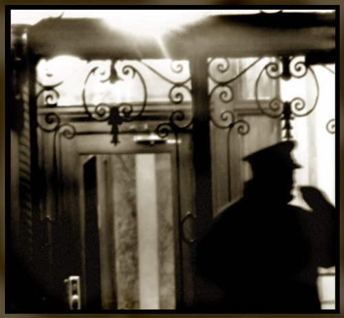 Doorman at night.Via Patty M. on Flickr.