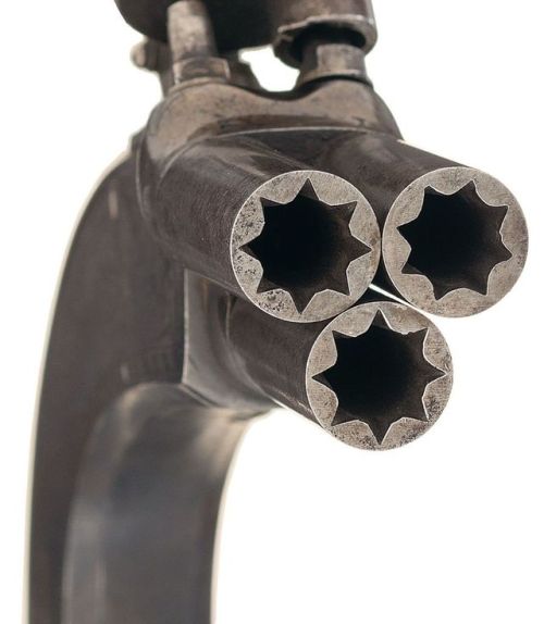 A pair of all metal three shot percussion pistol crafted by William & John Rigby of Dublin, Irel