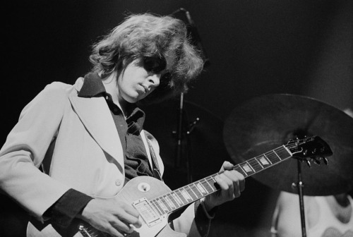 reluctant-martyrs:Guitarist Mick Taylor performing with the Rolling Stones at the Olympiahalle, Muni