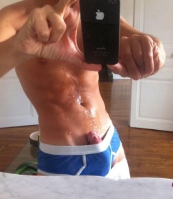 gaytaurean:  This guy takes it a step further than most, showing us his cum soaked abs in his exposed cock selfie!