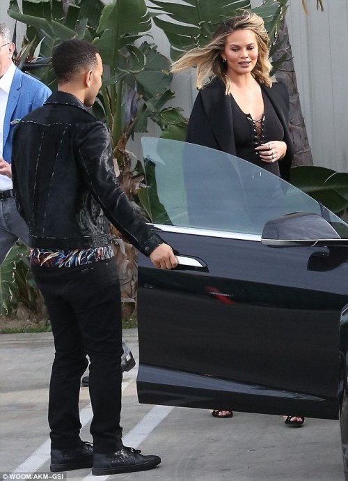 Chrissy Teigen stuns in form-fitting dress as she and husband John Legend leave Khloe Kardashian&