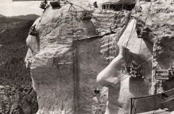 sixpenceee:  This photo from the construction of Mount Rushmore was taken in the late 1930s, just a few years before the monument’s completion in 1941. The project was absolutely immense in scope, especially considering that it was built on the heels