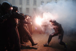 timelightbox:  Photograph by Dzhavakhadze Zurab—Itar-Tass/Corbis Supporters of European integration clash with riot police during a protest against government’s decision to delay signing a trade deal with the European Union, in Kiev, Ukraine, December