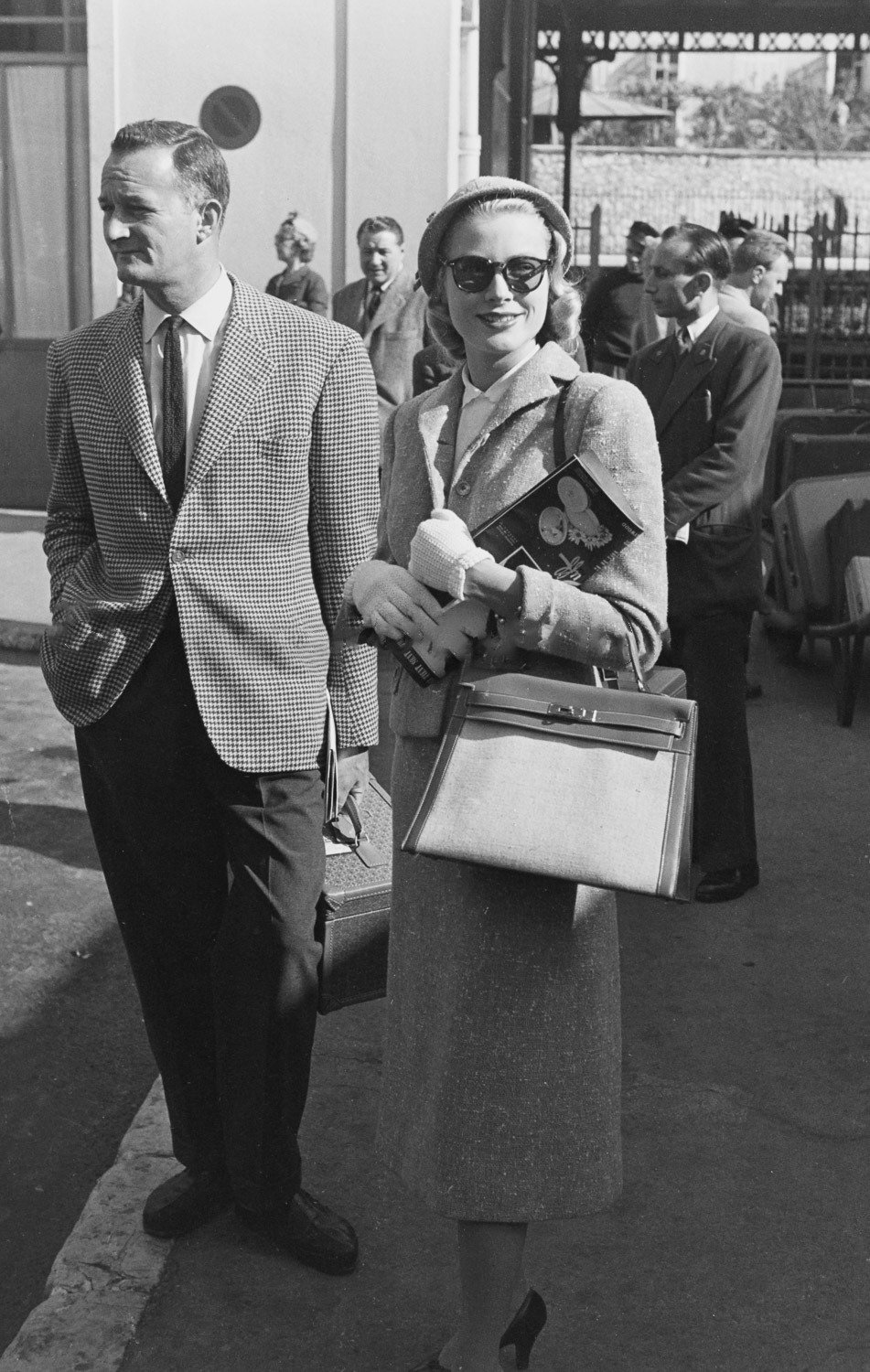 Grace & Family — Grace Kelly with the original Kelly Bag arriving