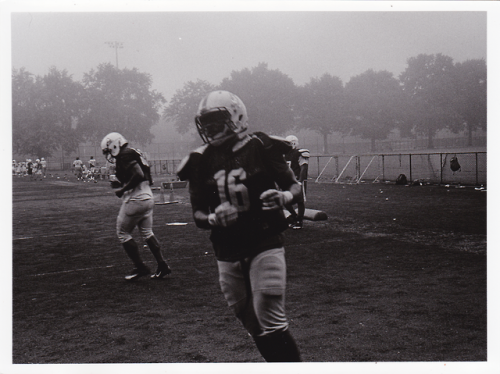 Some Football players during practice. Taken through the gate while on my way to work.6 x 8″ Fiber P