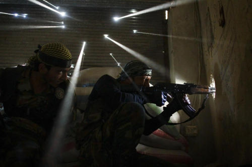 petapeta:  Photos: Pictures of the Year International Photo Contest 2013  POYi First Place - NEWS PICTURE STORY (Javier Manzano/Agence France-Presse) Two rebel soldiers stand guard in the Karmel Jabl neighborhood of Aleppo as more than a dozen holes made