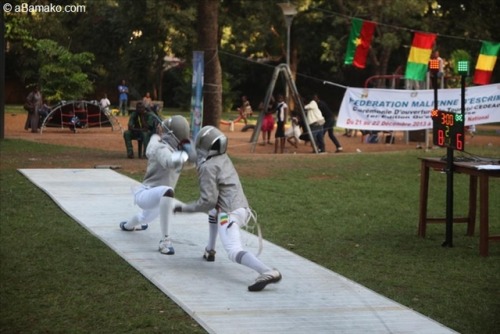 modernfencing: [ID: several photos of a sabre competition, fenced outside on metal strips.] Fencing 