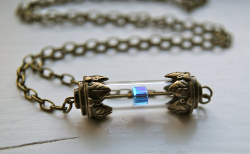 wickedclothes:  Tesseract Necklace Hold the ultimate power by wearing the tesseract around your neck. Maybe it will even attract Loki. Sold on Etsy.