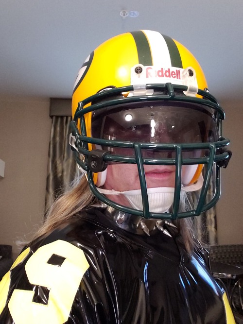 Packers helmet, PVC football jersey, and steel spiked collar - dog’s all set.