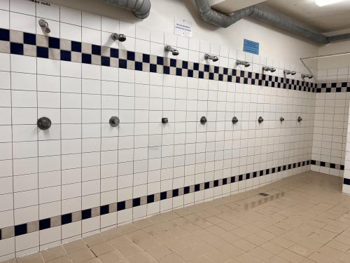 Shower room at the Hloubětín Swimming Pool &amp; Sports Centre in Prague, Czech Republic.