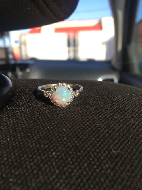 My engagement ring. Opal and white sapphires.