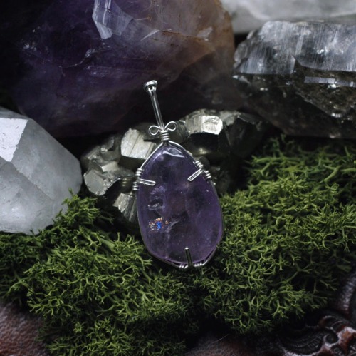 90377: 90377:Wonderful moss agate and lovely amethyst with a tiny rainbow inside. Both wire wrapped 