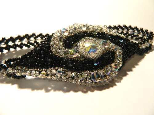 It is finished! This piece took 6 hours, and boasts 62 swarovski crystals. It is astonishingly spark