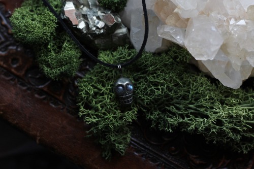 This pyrite skull necklace with labradorite eyes is available at Sedna90377.etsy.com
