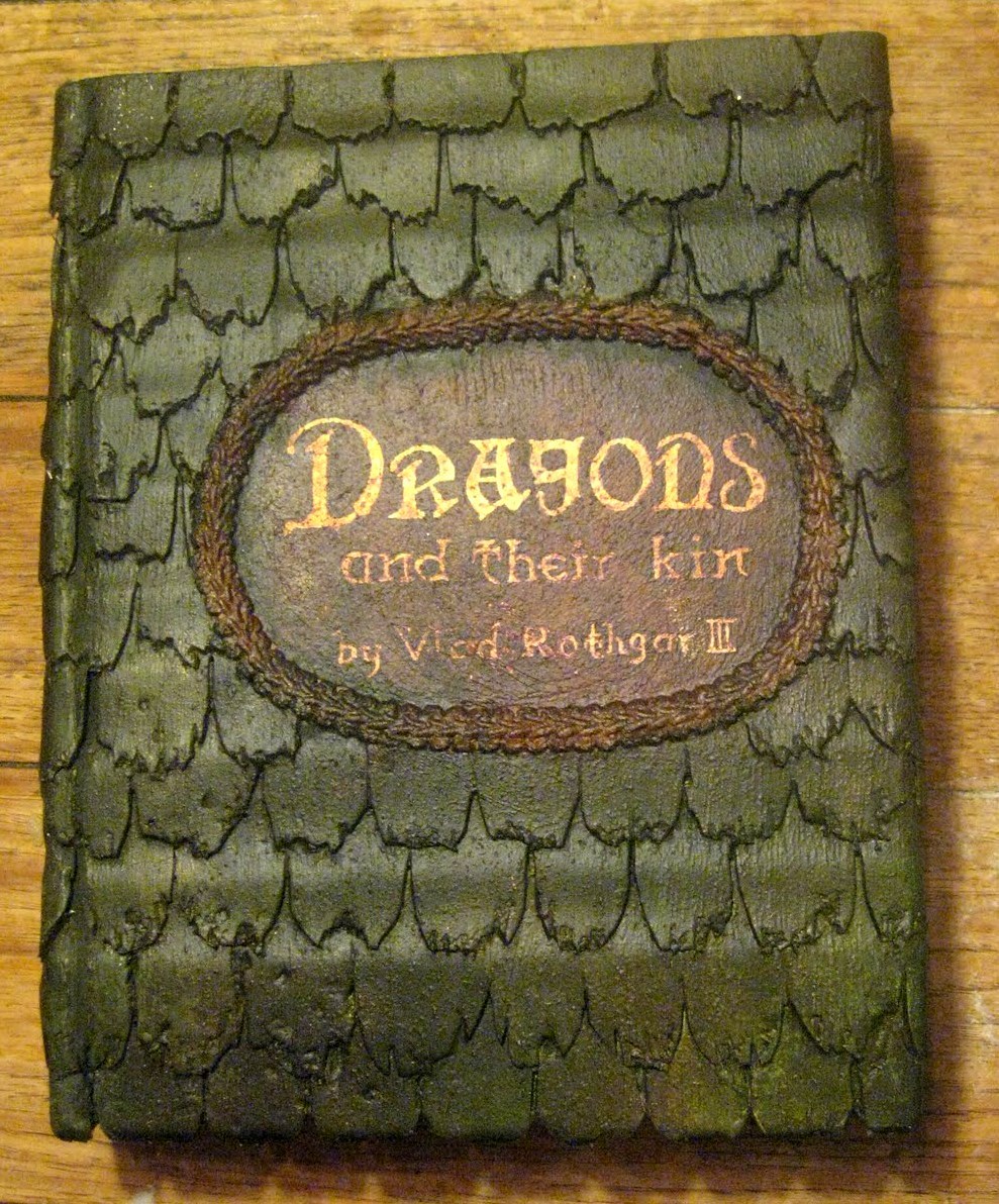 DIY Dragon Book Tutorial from Bascombe Mania. This is an extremely detailed tutorial that uses those sheets of sticky back craft foam. This may be a good Game of Thrones DIY.